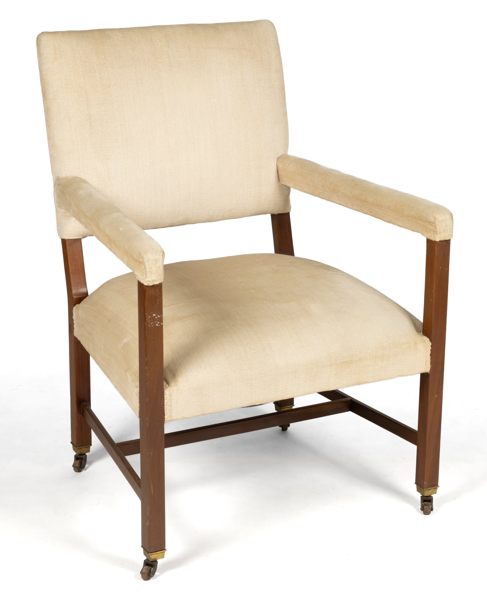 ENGLISH GEORGIAN MAHOGANY ARMCHAIR: ENGLISH GEORGIAN MAHOGANY ARMCHAIR, featuring a rectangular canted back over a generous trapezoidal seat flanked by open arms, the whole supported by rectangular legs connected by an H-stretcher