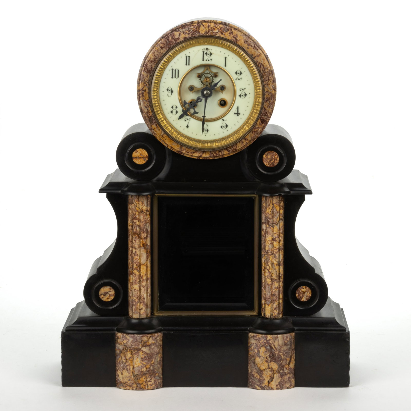 FRENCH SLATE AND MARBLE MANTEL / SHELF CLOCK: FRENCH SLATE AND MARBLE MANTEL / SHELF CLOCK, brass spring-driven 8-day movement, the black slate case accented with highly-figured marble elements, centering a beveled glass window which would look t