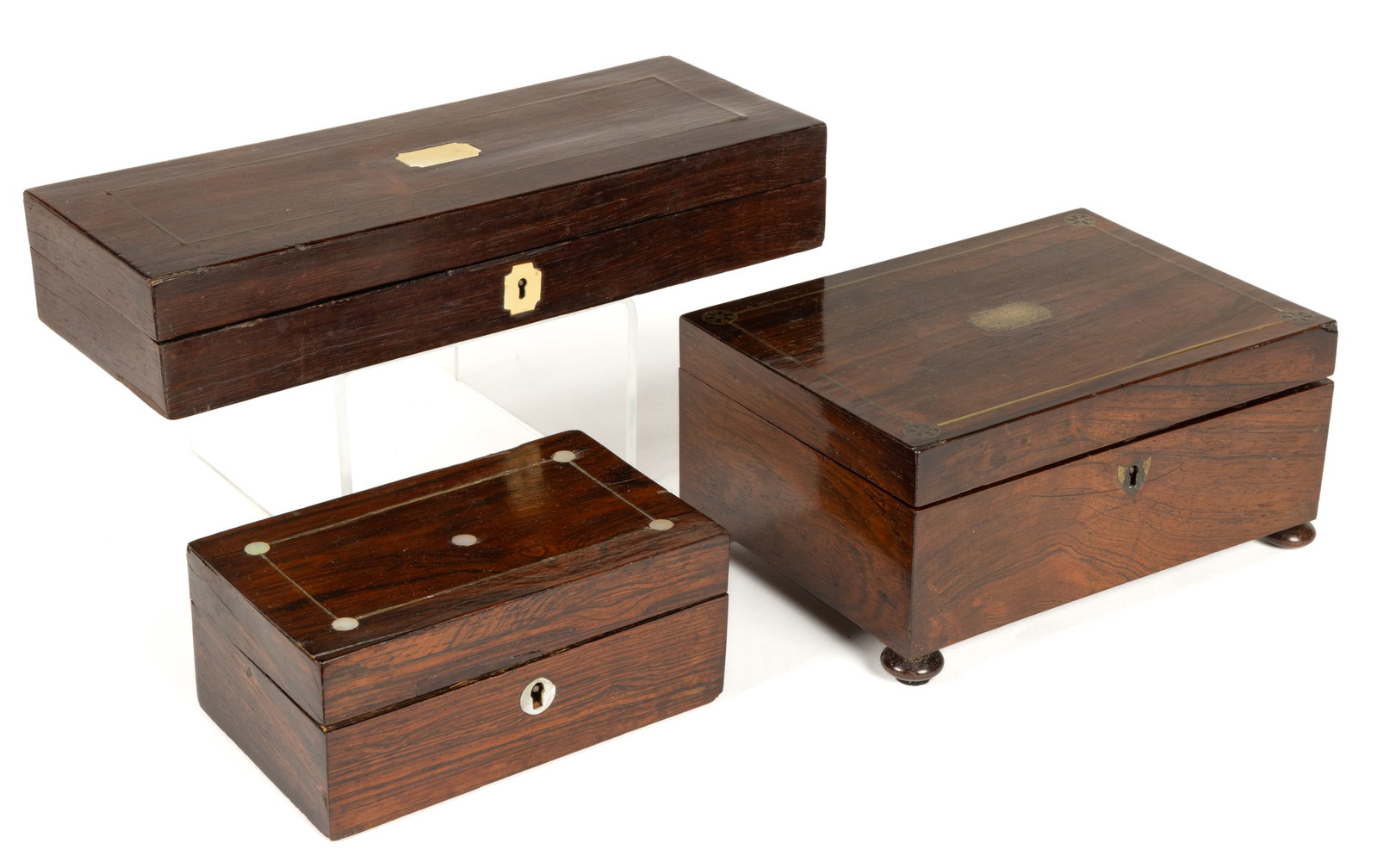 ASSORTED BRITISH WOODEN ROSEWOOD AND INLAID DOCUMENT / DRESSER / SEWING BOXES, LOT OF THREE: ASSORTED BRITISH WOODEN ROSEWOOD AND INLAID DOCUMENT / DRESSER / SEWING BOXES, LOT OF THREE, each of rectangular-form with a hinged lid and having brass inlaid decoration, comprising of two 