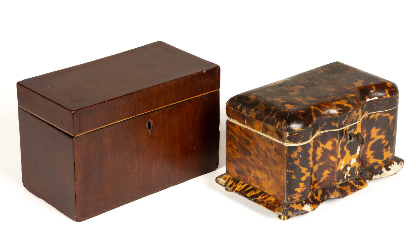 BRITISH WOODEN TEA CADDIES, LOT OF TWO: BRITISH WOODEN TEA CADDIES, LOT OF TWO, each of rectangular form with hinged lid, each having a single open interior compartment, comprising of a mahogany example, interior with a pale blue paper lini