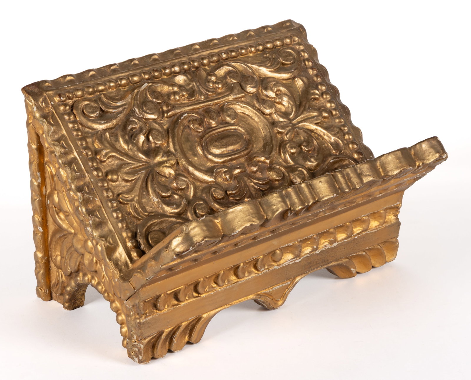 CONTINENTAL GILTWOOD BIBLE STAND: CONTINENTAL GILTWOOD BIBLE STAND, carved wood with a gilt gesso covering. Retains the likely original gilt surface. 20th century. 9 3/4" HOA, 14 3/4" WOA, 10 1/4" DOA. Provenance: The e