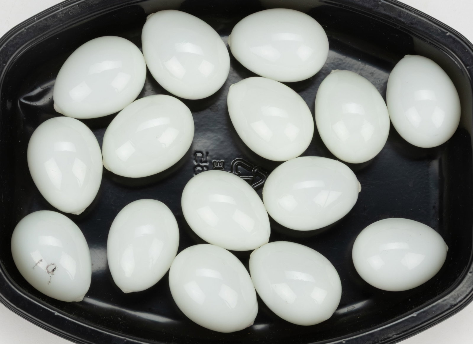 BLOWN GLASS DIMINUTIVE SIZED EGGS, LOT OF 15: BLOWN GLASS DIMINUTIVE SIZED EGGS, LOT OF 15, opal, each being quail-sized, each with a rough pontil mark. 19th century. Approximately 1 1/2" LOA.