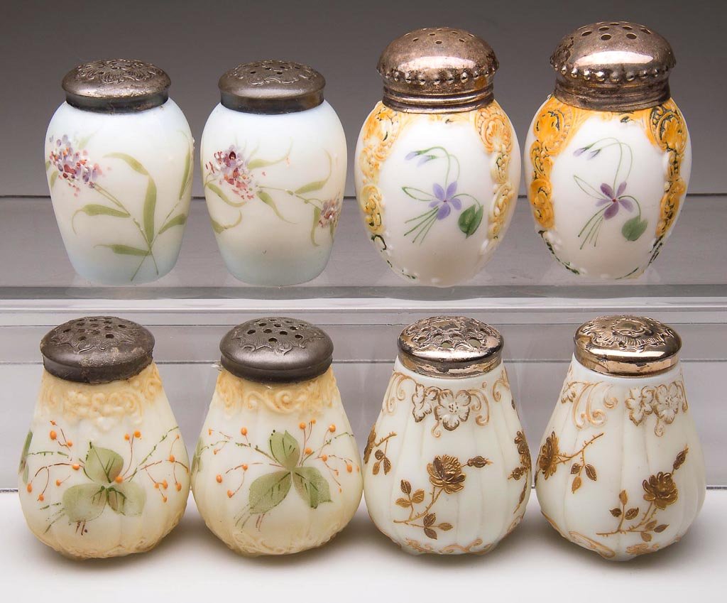 ASSORTED MT. WASHINGTON / PAIRPOINT SALT AND PEPPER SHA: ASSORTED MT. WASHINGTON / PAIRPOINT SALT AND PEPPER SHAKERS, LOT OF EIGHT, opal with plush/satin finish and gilt or polychrome floral decorations, pairs of Barrel - Narrow Base, Leaf - Four Feet Berry