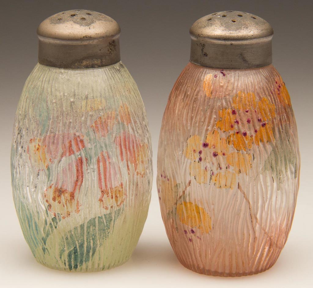 MT. WASHINGTON BARK SALT SHAKERS, LOT OF TWO: MT. WASHINGTON BARK SALT SHAKERS, LOT OF TWO, colorless with green and rose stained grounds, various enamel floral decorations, period lids. Mt. Washington Glass Co. Fourth quarter 19th century. 3" HO