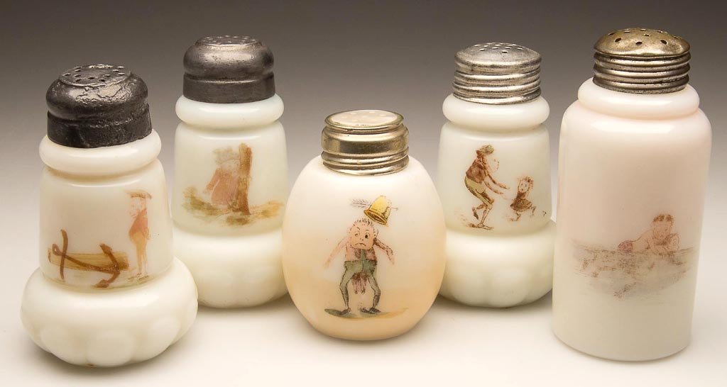 ASSORTED MT. WASHINGTON PALMER COX BROWNIE SALT AND PEP: ASSORTED MT. WASHINGTON PALMER COX BROWNIE SALT AND PEPPER SHAKERS, LOT OF FIVE, opal with transfer decoration on front and reverse, various shapes, most with period lids. Mt. Washington Glass Co. Lat