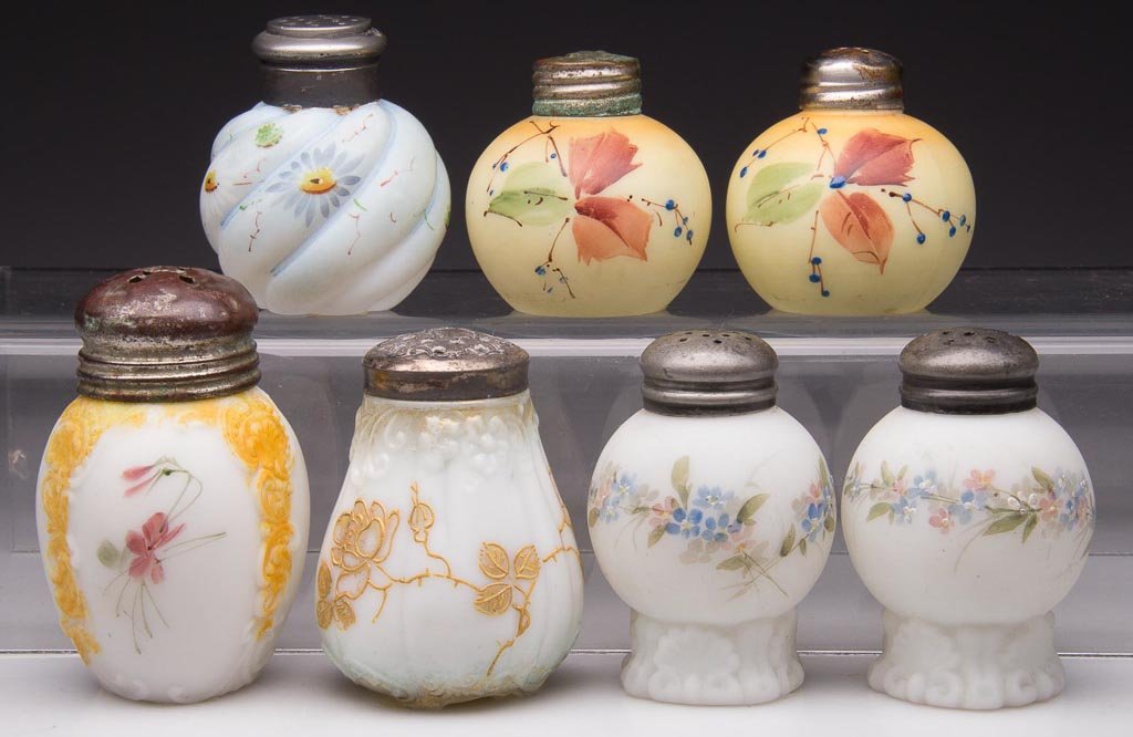 ASSORTED MT. WASHINGTON / PAIRPOINT SALT AND PEPPER SHA: ASSORTED MT. WASHINGTON / PAIRPOINT SALT AND PEPPER SHAKERS, LOT OF SEVEN, opal with plush/satin finish and gilt or polychrome floral decorations, pairs and singles, comprising Leaf - Four Feet Gilt, 