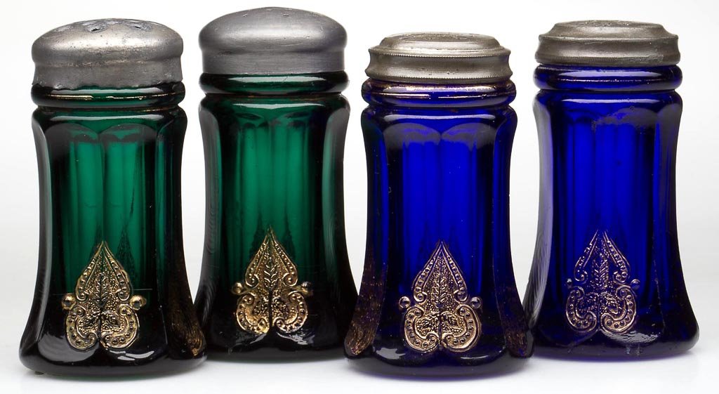 NORTHWOOD REGENT / LEAF MEDALLION TWO PAIR OF SALT AND : NORTHWOOD REGENT / LEAF MEDALLION TWO PAIR OF SALT AND PEPPER SHAKERS, deep blue and deep green, each with gilt decoration, period lids. H. Northwood Co. Early 20th century. 3 1/4" and 3 1/2" HOA. Pro