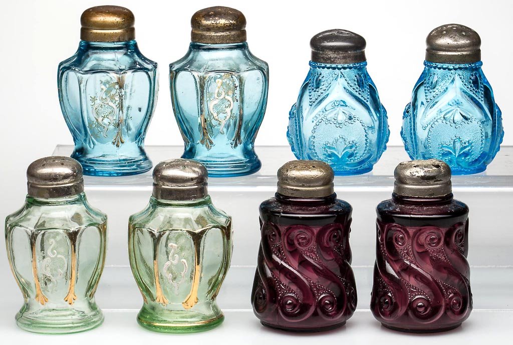 ASSORTED PATTERN SALT AND PEPPER SHAKERS, LOT OF EIGHT: ASSORTED PATTERN SALT AND PEPPER SHAKERS, LOT OF EIGHT, pairs, comprising blue Jeweled Heart, amethyst S-Repeat, and blue and green Nestor with gilt and enamel decorations, period lids. Northwood Glas