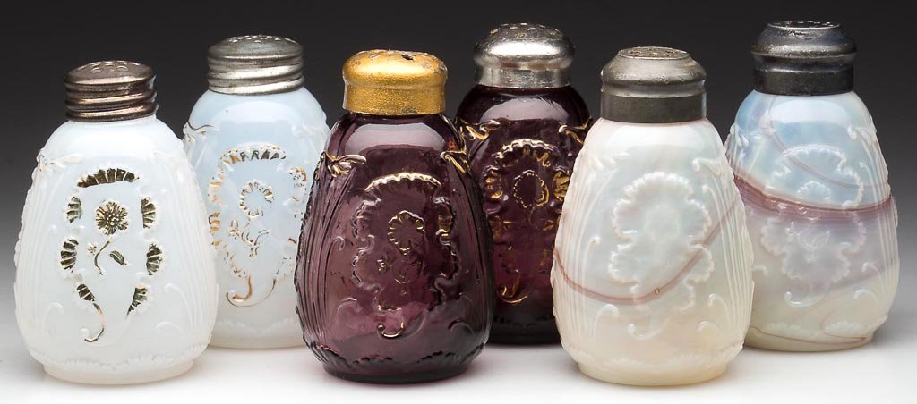 EVERGLADES / CARNELIAN SALT AND PEPPER SHAKERS, THREE P: EVERGLADES / CARNELIAN SALT AND PEPPER SHAKERS, THREE PAIR, comprising colorless opalescent, amethyst and translucent purple slag, four with gilt decoration, four with period lids. H. Northwood Co. Ea