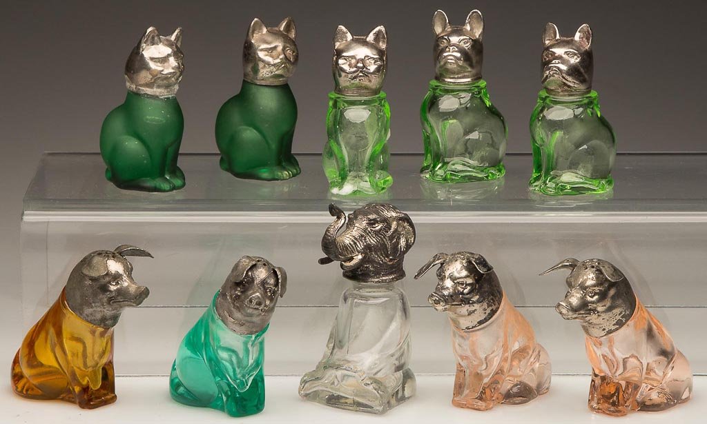 ASSORTED ANIMAL FIGURAL SALT AND PEPPER SHAKERS, LOT OF: ASSORTED ANIMAL FIGURAL SALT AND PEPPER SHAKERS, LOT OF TEN, pink, green, amber and colorless, two with satin finish, comprising pigs, cats, dogs and an elephant, original metal lids. First half 20th 