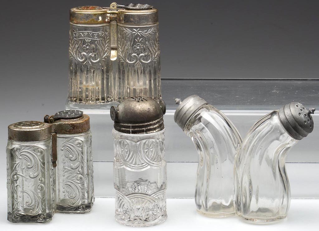 ASSORTED PATENTED SALT AND PEPPER SHAKERS, LOT OF FOUR: ASSORTED PATENTED SALT AND PEPPER SHAKERS, LOT OF FOUR, colorless, comprising two different Parker combinations, a McKee Siamese Twins, and a Thomson patent ratchet-style lid. Fourth quarter 19th/earl
