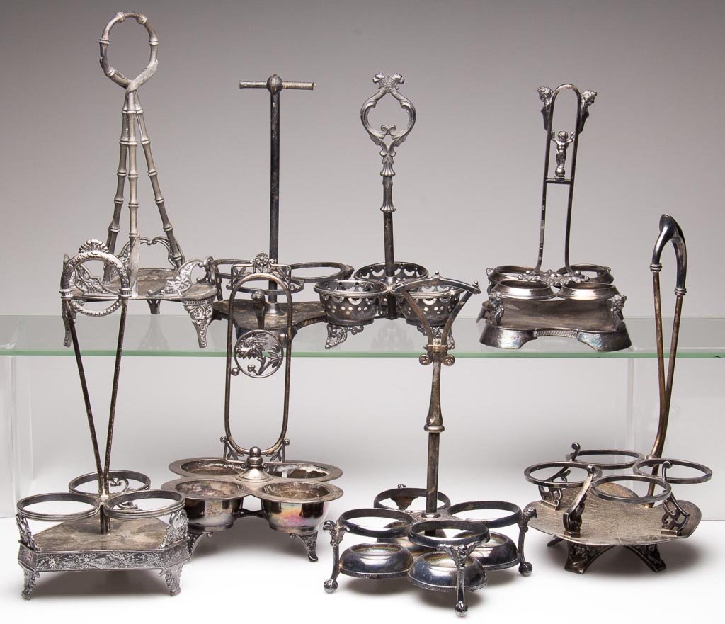 VICTORIAN QUADRUPLE-PLATE ASSORTED STANDS, LOT OF EIGHT: VICTORIAN QUADRUPLE-PLATE ASSORTED STANDS, LOT OF EIGHT, manufacturer's marks include Pairpoint, Wilcox, and Meriden. Fourth quarter 19th/early 20th century. 8 3/4" to 11 1/4" HOA. Provenance: The col