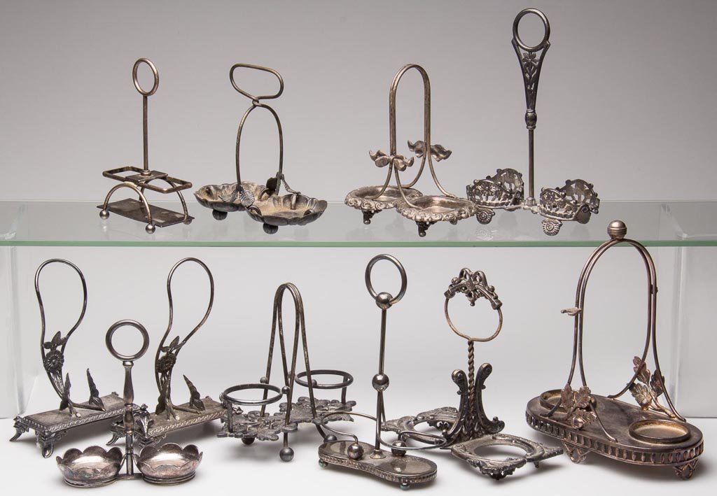 VICTORIAN QUADRUPLE-PLATE TWO-SHAKER STANDS, LOT OF 11: VICTORIAN QUADRUPLE-PLATE TWO-SHAKER STANDS, LOT OF 11, manufacturer's marks include Pairpoint, Homan and Meriden. Fourth quarter 19th/early 20th century. 5 1/2" to 7" HOA. Provenance: The collection 
