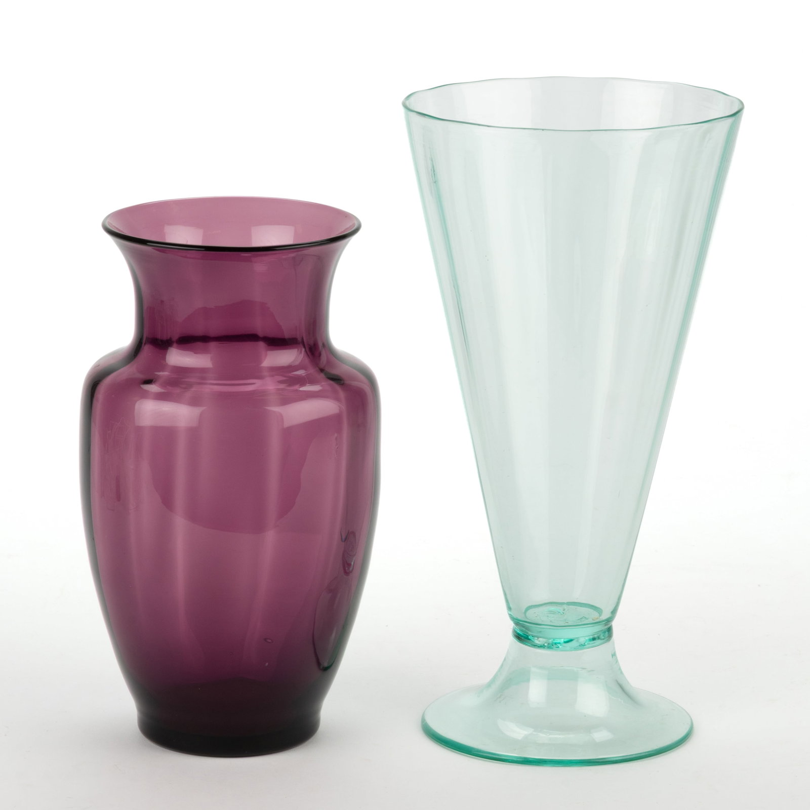 ASSORTED PANEL-OPTIC ART GLASS VASES, LOT OF TWO: ASSORTED PANEL-OPTIC ART GLASS VASES, LOT OF TWO, comprising an amethyst urn form and a green depression glass (reacts under black light) trumpet form with circular foot, no signatures located. M
