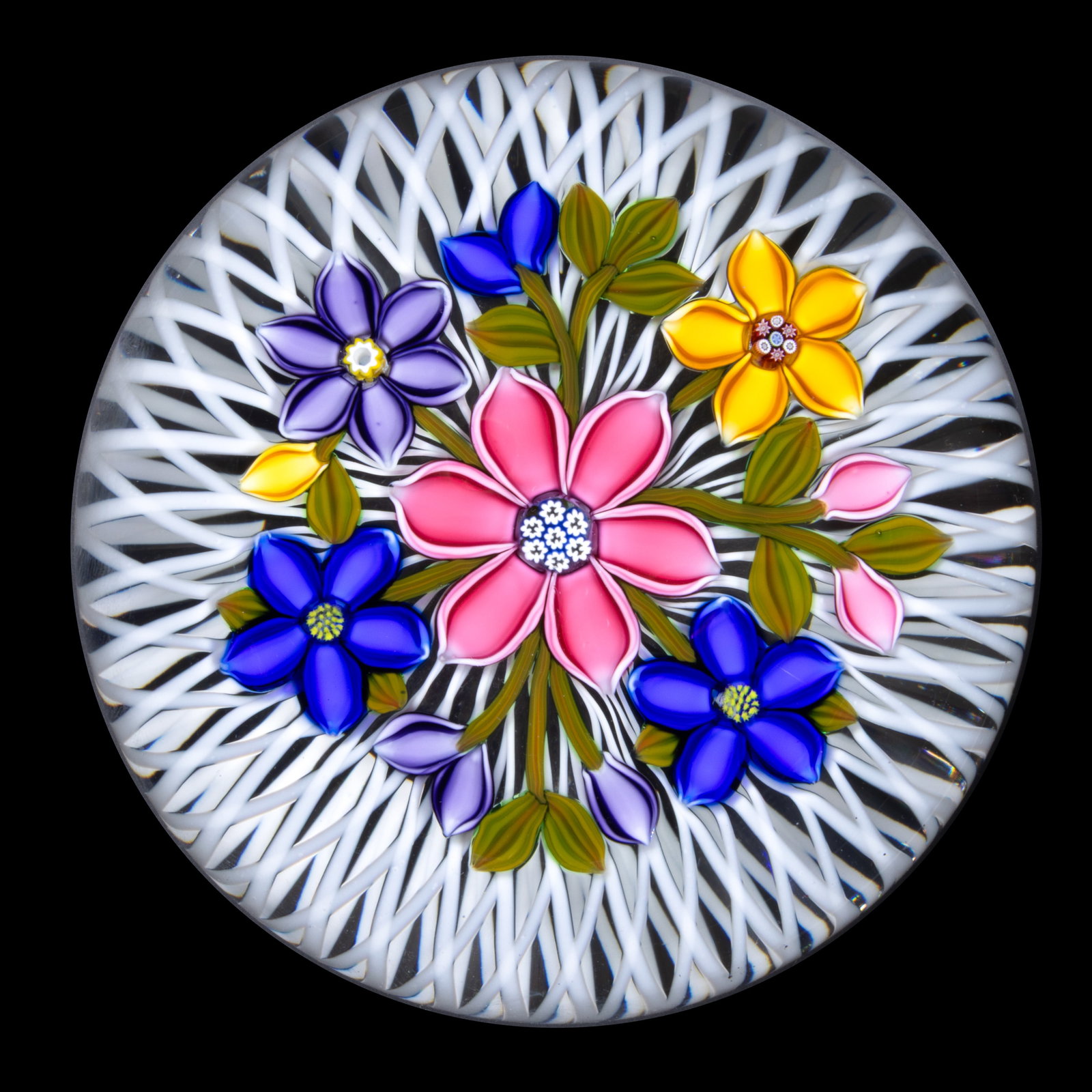 PETER MCDOUGALL (SCOTTISH, B. 1952) FLORAL BOUQUET LAMPWORK AND MILLEFIORI STUDIO ART GLASS: PETER MCDOUGALL (SCOTTISH, B. 1952) FLORAL BOUQUET LAMPWORK AND MILLEFIORI STUDIO ART GLASS PAPERWEIGHT, a bouquet of multicolored flowers and green leaves over an opal latticinio basket ground, signa
