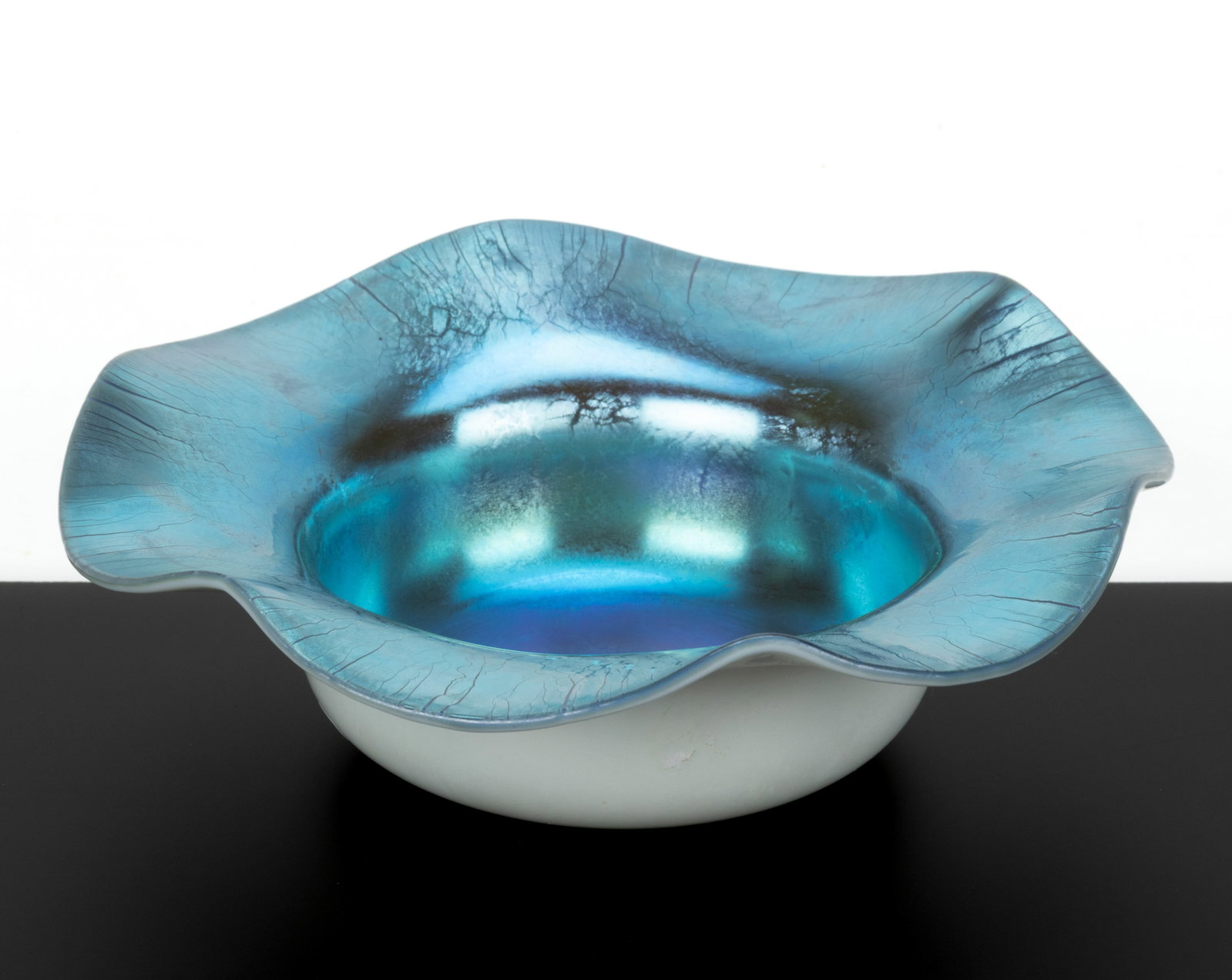 STEUBEN BLUE CALCITE OPEN SALT: STEUBEN BLUE CALCITE OPEN SALT, shape 138, flat form with gauffered rim, no signature located, polished pontil mark. Steuben Glass Works. Circa 1925. 1 7/8" H, 6" D. Published: Jzyk/Robertso
