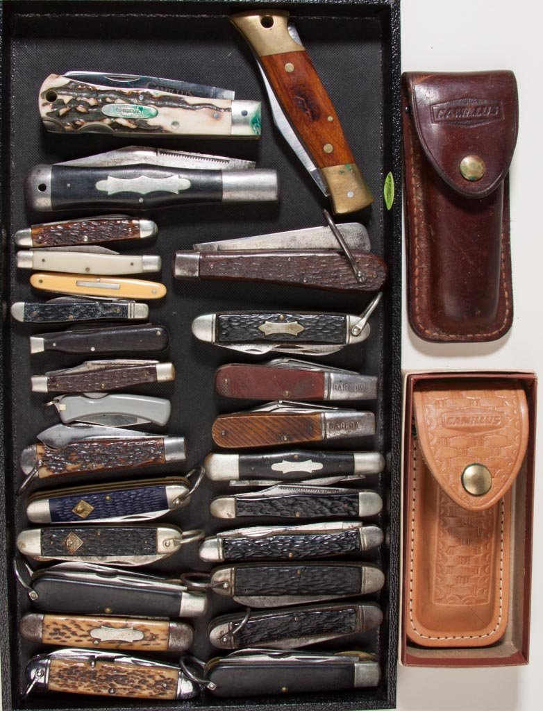 CAMILLUS CUTLERY CO. POCKET KNIVES, LOT OF 27: CAMILLUS CUTLERY CO. POCKET KNIVES, LOT OF 27, various handles including bone, wood, and plastic, including a No. 4 "Sword Brand", purple "Cub Scout", No. 22769 Barlow, and a stag handle No 716 with N