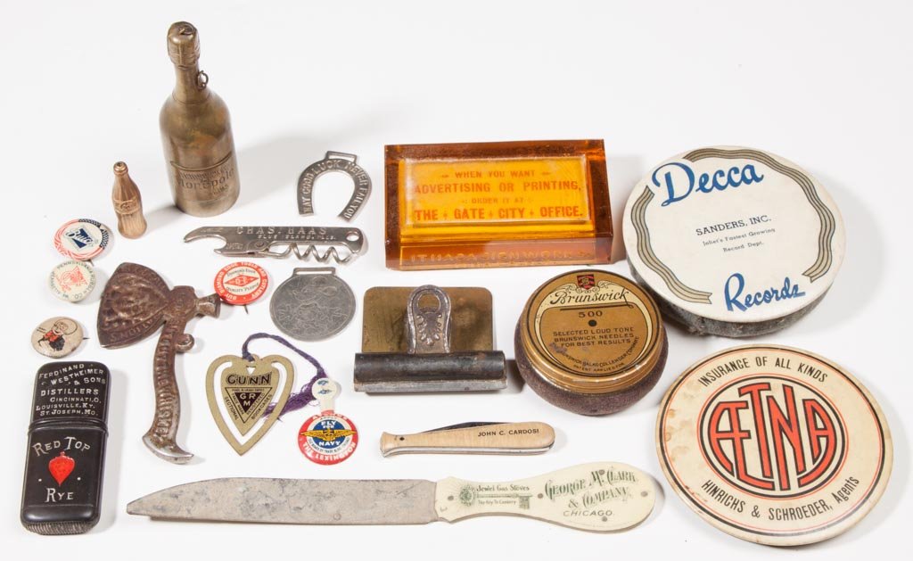 ASSORTED ADVERTISING AND OTHER ARTICLES, LOT OF 20: ASSORTED ADVERTISING AND OTHER ARTICLES, LOT OF 20, including a celluloid Red Top Rye match safe, a cast-iron Laurel Stoves & Ranges "Cut Out The Whiskey" ax, a Mickey Mouse watch fob, and two record