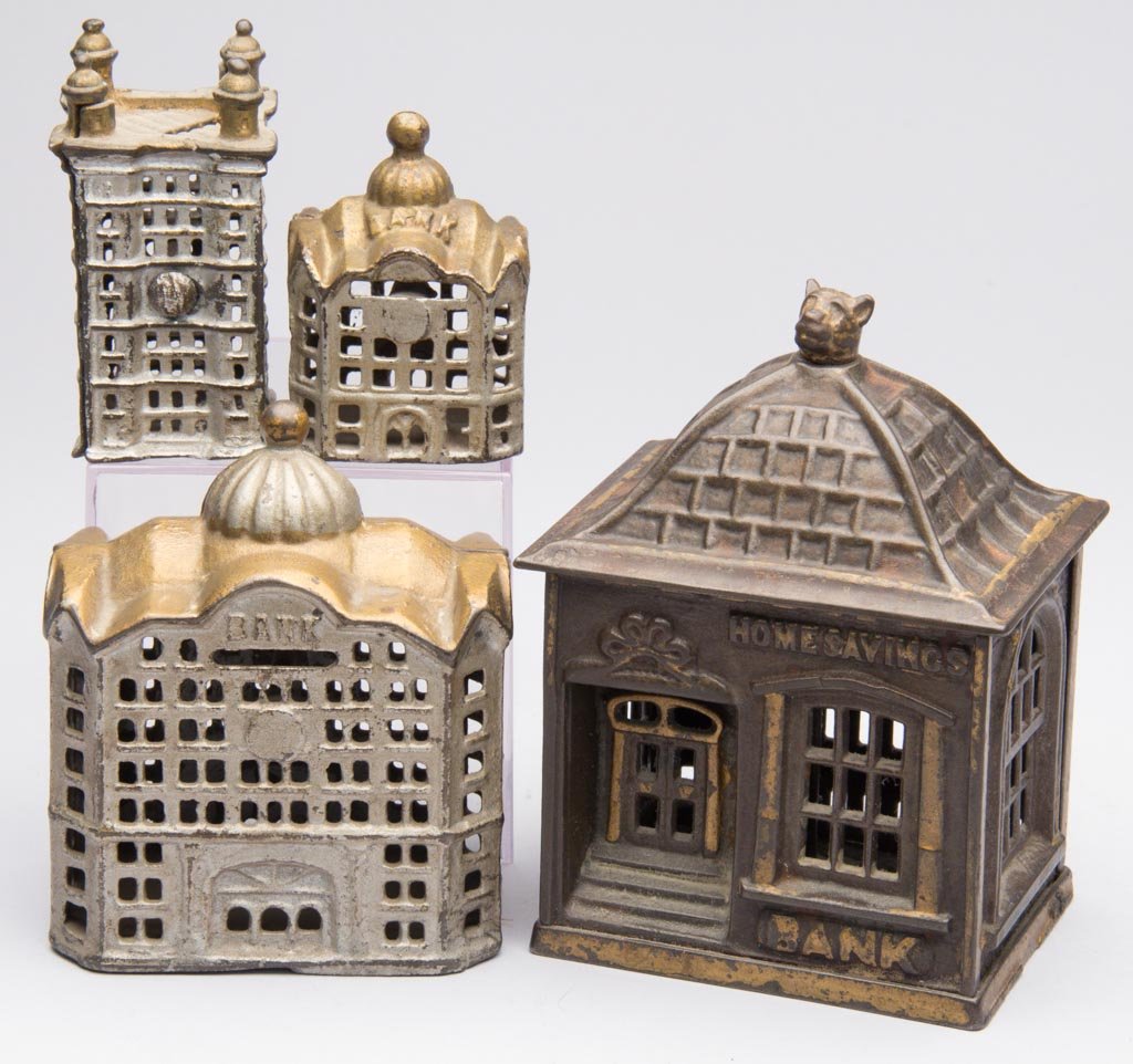 ASSORTED BUILDING CAST-IRON PENNY BANKS, LOT OF FOUR: ASSORTED BUILDING CAST-IRON PENNY BANKS, LOT OF FOUR, comprising a Home Savings Bank with dog finial, two Domed Banks, and a small skyscraper. J. & E. Stevens & Co. and A.C. Williams & Co. Fourth quar