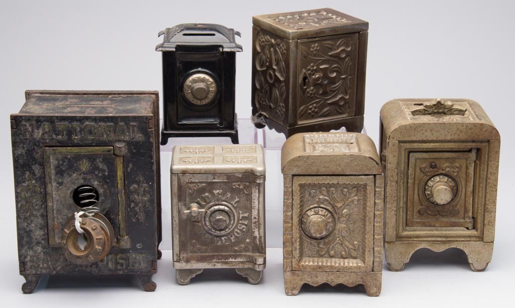 ASSORTED SAFE CAST-IRON PENNY BANKS, LOT OF SIX: ASSORTED SAFE CAST-IRON PENNY BANKS, LOT OF SIX, including nickel-plated. Fourth quarter 19th/first quarter 20th century. 3 3/4" to 6" HOA. Provenance: From the collection of the late Betty Jane Renn,
