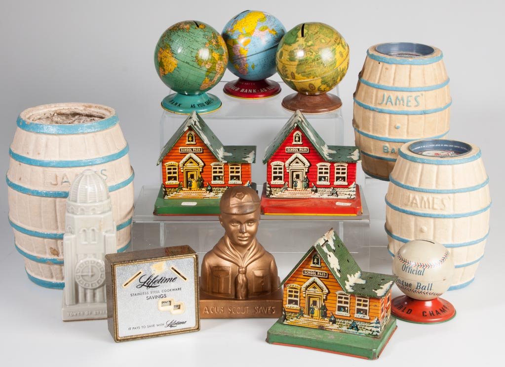ASSORTED FIGURAL MONEY BANKS, LOT OF 13: ASSORTED FIGURAL MONEY BANKS, LOT OF 13, including tin, pressed-board and ceramic, several by the Ohio Art Co. 20th century. 4" to 9" H. Provenance: From the collection of the late Betty Jane Renn, Su