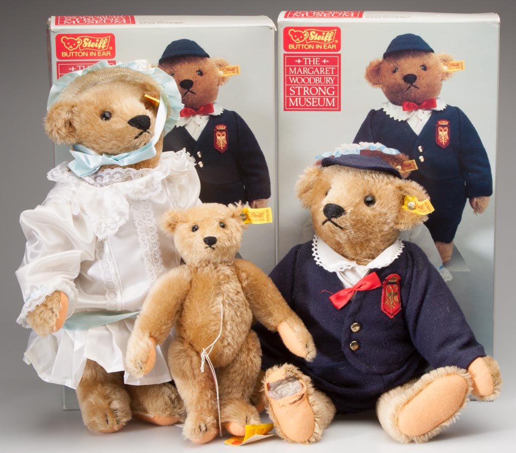 STEIFF REPLICA TEDDY BEARS, LOT OF THREE: STEIFF REPLICA TEDDY BEARS, LOT OF THREE, including Strong Museum Victorian Boy and Girl with boxes, one with growler. Second half 20th century. 9 1/2" to 14 1/2" H. Provenance: The Elizabeth P. Croft