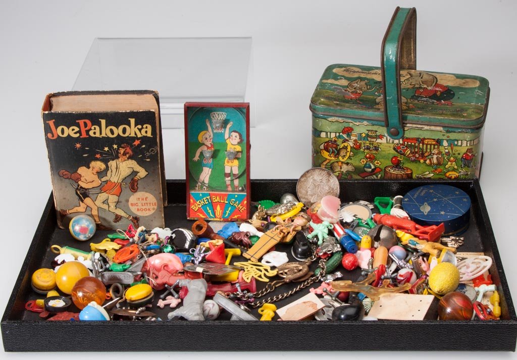 ASSORTED TOYS AND OTHER ARTICLES: ASSORTED TOYS AND OTHER ARTICLES, uncounted lot, including a lithographed tin United Happiness Candy Stores lunch pail box, a 1922 OS silver dollar, a Joe Polooka Big Little Book, and a group of Crack