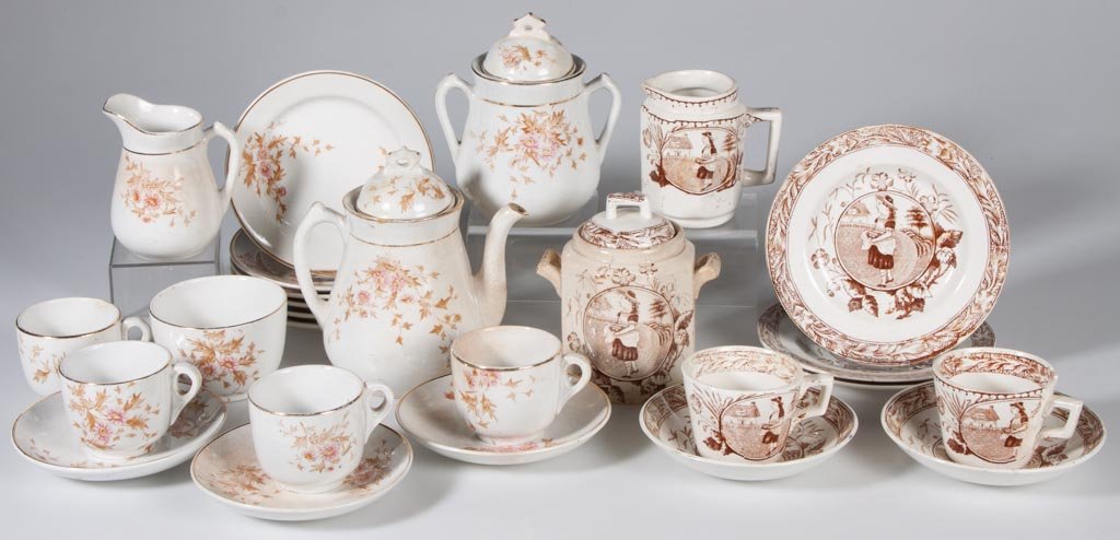 ENGLISH IRONSTONE CHILDREN'S DISHES, LOT OF 26: ENGLISH IRONSTONE CHILDREN'S DISHES, LOT OF 26, comprising two partial sets, each with transfer decorations. Late 19th/early 20th century. Largest 5 1/2" H. Provenance: The estate collection of Richar