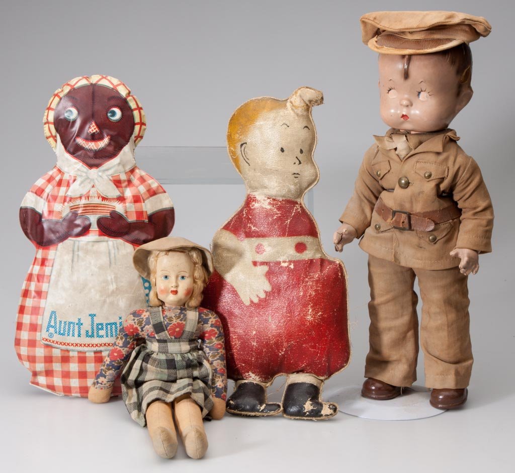 ASSORTED VINTAGE DOLLS, LOT OF FOUR: ASSORTED VINTAGE DOLLS, LOT OF FOUR, including an Effanbee Skippy composition soldier doll with original uniform, a Skeezix canvas doll, and an Aunt Jemima soft vinyl doll. First half 20th century. 11