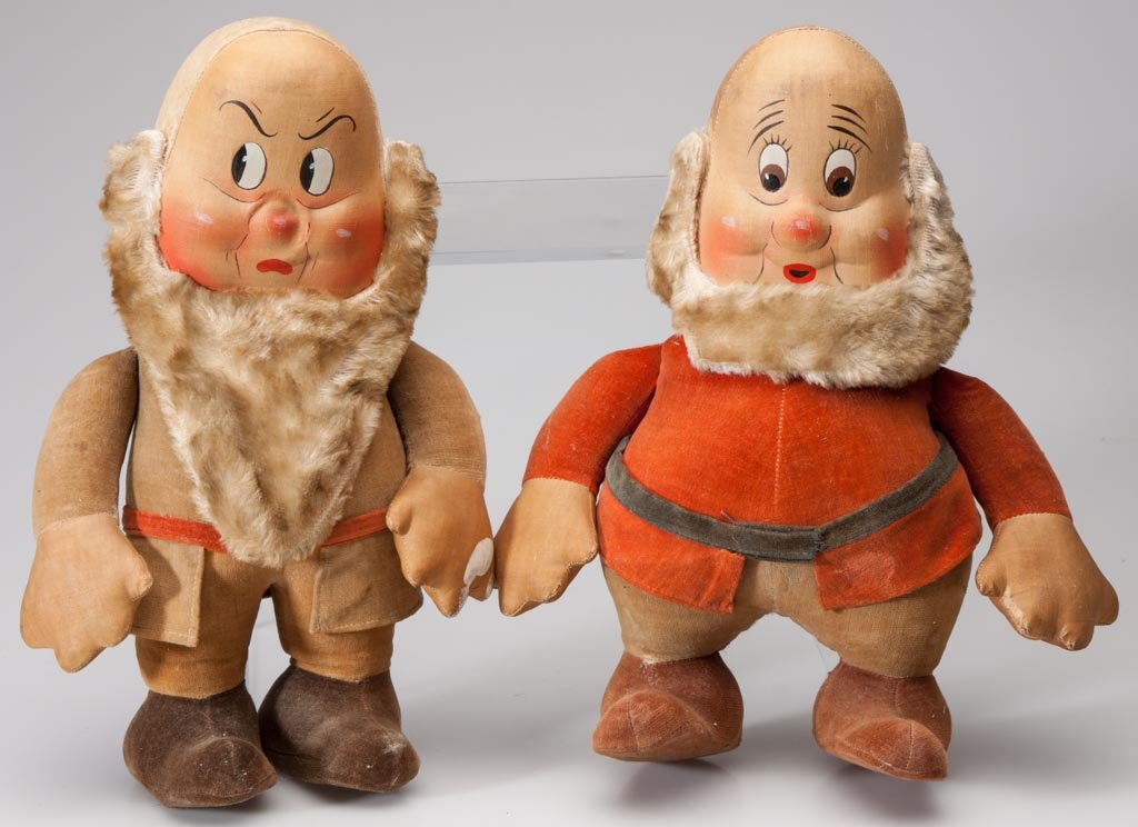 GRUMPY AND DOC DWARF DOLLS, LOT OF TWO: GRUMPY AND DOC DWARF DOLLS, LOT OF TWO, felt, velveteen and oil cloth, from Snow White and the Seven Dwarfs. Circa 1935. 11 1/2"H. Provenance: From a Virginia collection.