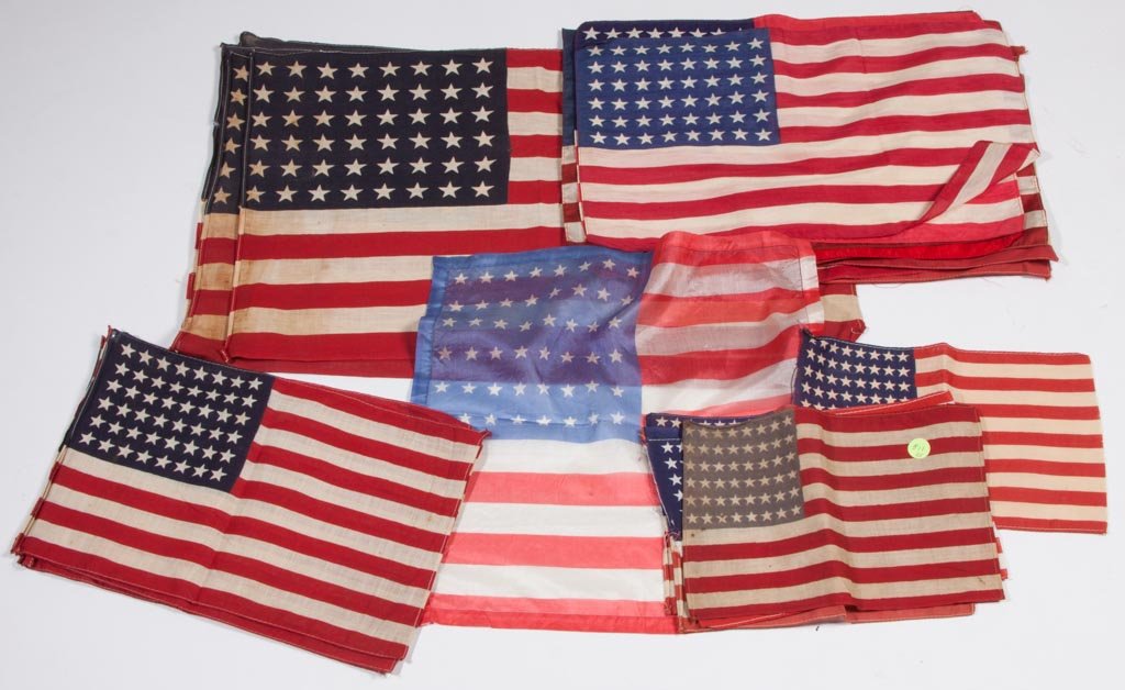 48-STAR UNITED STATES PARADE FLAGS, LOT OF 25: 48-STAR UNITED STATES PARADE FLAGS, LOT OF 25, printed silk and cotton. Circa 1912-1959. 7" x 10 1/2" to 13 1/2" x 22". Provenance: Property of a New York City lady.