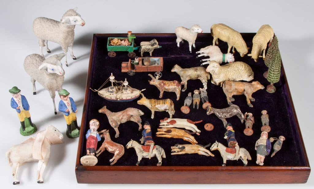 ASSORTED GERMAN PAPIER-MACHE AND WOOD ANIMALS AND: ASSORTED GERMAN PAPIER-MACHE AND WOOD ANIMALS AND FIGURES, uncounted lot, including five sheep with fur and various carved and painted wood examples. First quarter 20th century. Tallest 4" H. Provenan