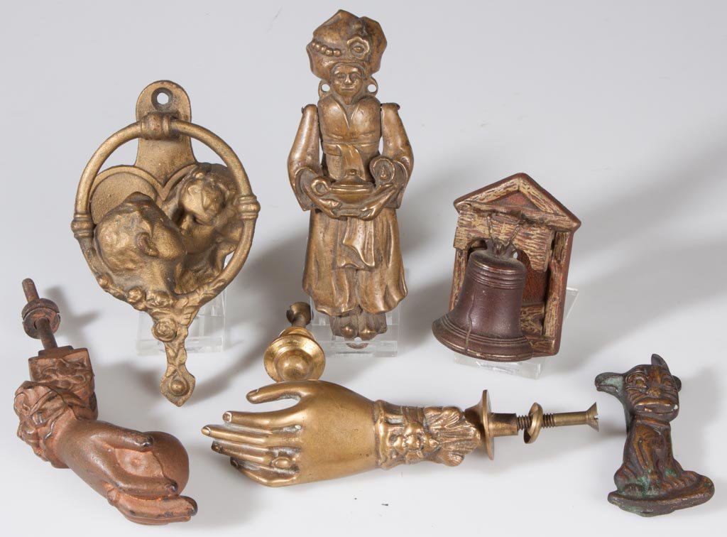 BRASS AND CAST-IRON FIGURAL DOOR KNOCKERS, LOT OF SIX: BRASS AND CAST-IRON FIGURAL DOOR KNOCKERS, LOT OF SIX, one marked "Aladdin Homes", another "Made in England". Fourth quarter 19th/first half 20th century. 3 1/4" to 6" H. Provenance: From an Illinois 