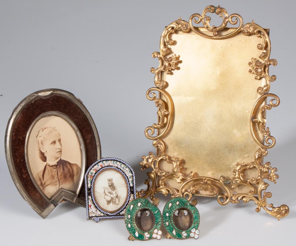 ASSORTED STAND-UP PICTURE FRAMES, LOT OF FOUR: ASSORTED STAND-UP PICTURE FRAMES, LOT OF FOUR, including a gilt-brass Rococo style, an Italian micro-mosaic, and an enamel-decorated brass double frame. Late 19th/first quarter 20th century. 1 7/8" to