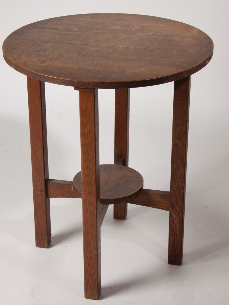 L. & J. G. STICKLEY ARTS AND CRAFTS OAK LAMP TABLE: L. & J. G. STICKLEY ARTS AND CRAFTS OAK LAMP TABLE, circular top and lower shelf, not signed. Original finish. First quarter 20th century. 29" H, 24" D. Provenance: From a Virginia private collection.