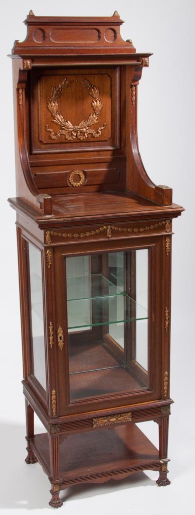 EDWARDIAN MAHOGANY CURIO CABINET: EDWARDIAN MAHOGANY CURIO CABINET, gilt-metal mounts, single door and glass shelf, raised on carved claw feet. Late 19th/early 20th century. 58" H, 17 1/2" W. Provenance: From an Illinois private colle