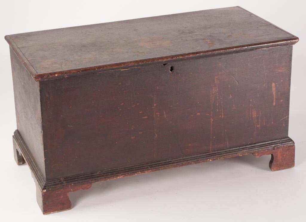 SHENANDOAH VALLEY OF VIRGINIA WALNUT DIMINUTIVE BLANKET: SHENANDOAH VALLEY OF VIRGINIA WALNUT DIMINUTIVE BLANKET CHEST, hinged lid with applied moldings above a half-blind dovetailed case raised on applied cut-out bracket feet. Interior till and later strap