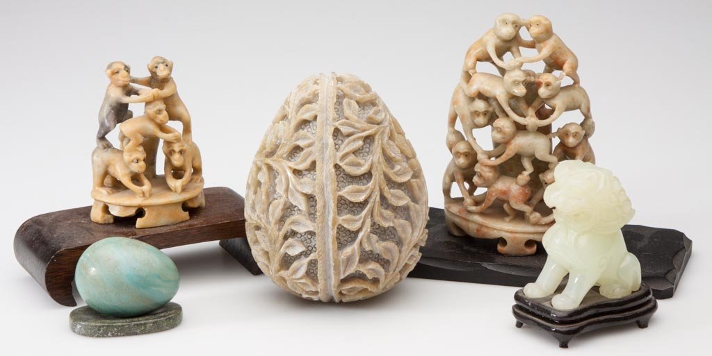 CHINESE CARVED STONE ARTICLES, LOT OF FIVE: CHINESE CARVED STONE ARTICLES, LOT OF FIVE, including a jade lion and two soapstone monkey pyramids. 20th century. 1 1/2" to 5" HOA. Provenance: Collection of Lloyd and Nan Graham, Newbury Park, CA. C