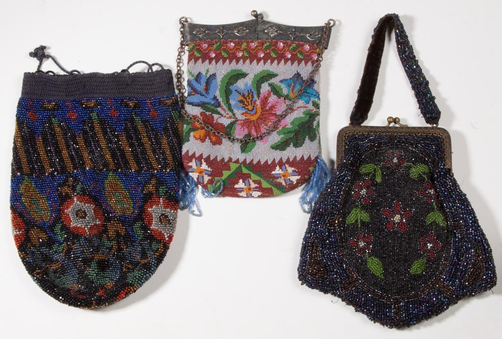 VINTAGE LADY'S BEADED PURSES, LOT OF THREE: VINTAGE LADY'S BEADED PURSES, LOT OF THREE, one with folding silver-tone metal frame and chain, one with gold-tone metal frame and beaded strap, third with drawstring, polychrome floral designs. Circa