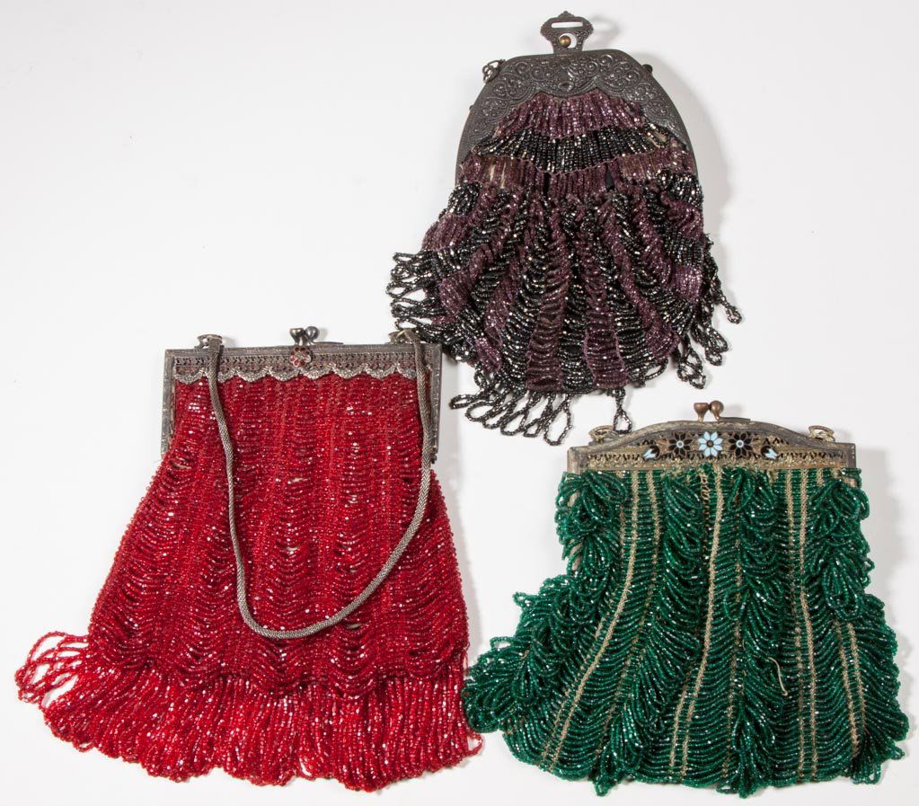 VINTAGE LADY'S BEADED PURSES, LOT OF THREE: VINTAGE LADY'S BEADED PURSES, LOT OF THREE, each with gold-tone metal frame, drape-pattern beading and original chain, two frames with enamel decorations, original and replaced linings. Circa 1925. 7"