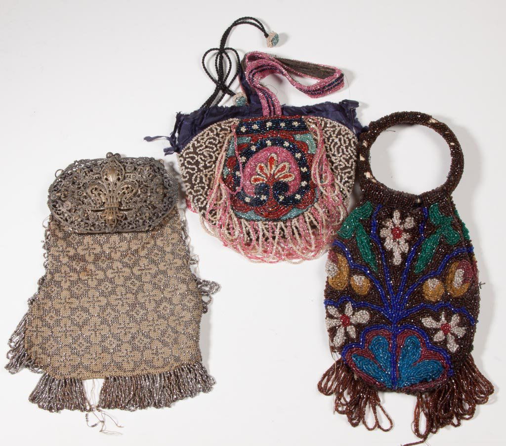 VINTAGE LADY'S BEADED PURSES, LOT OF THREE: VINTAGE LADY'S BEADED PURSES, LOT OF THREE, assorted styles, one with ornate silver-tone metal frame and chain. Circa 1925. 7" to 9" L. Provenance: From a private South Carolina collection.Circa:Circa