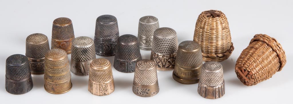 ASSORTED VINTAGE THIMBLES, LOT OF 13: ASSORTED VINTAGE THIMBLES, LOT OF 13, including nine sterling silver examples, several marked for Simons Brothers. Together with two woven basket thimble cases. Fifteen (15) pieces total. 19th and 20t