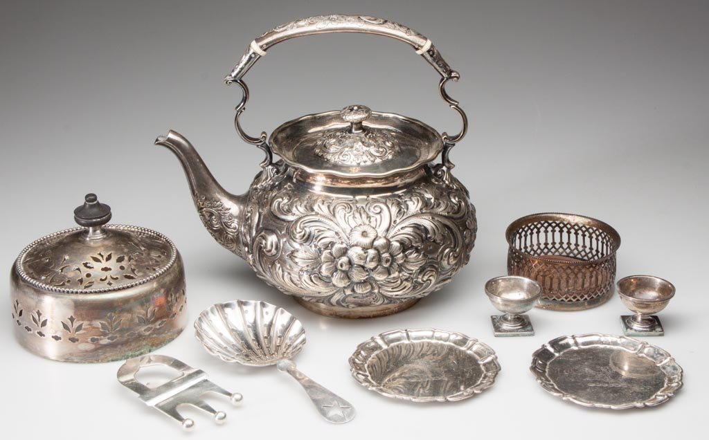 ASSORTED PLATED SILVER ARTICLES, LOT OF NINE: ASSORTED PLATED SILVER ARTICLES, LOT OF NINE, including an unmarked repousse teapot. 20th century. Teapot: 7 1/2" HOA. Provenance: Property from the Estate of Nicholas deBelleville Katzenbach, Princet