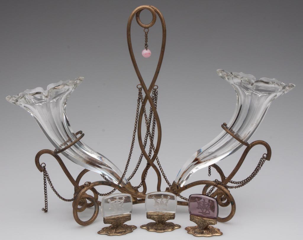 ASSORTED CONTINENTAL GLASS ARTICLES, LOT OF FOUR: ASSORTED CONTINENTAL GLASS ARTICLES, LOT OF FOUR, comprising three Czechoslovakian intaglio place card holders with brass bases, and a panel-cut pair of cornucopia vases in a gilt-brass entwined stand