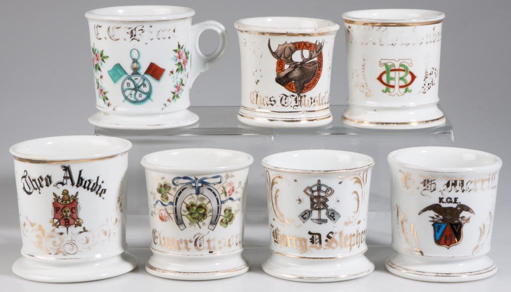 ASSORTED FRATERNAL AND OTHER PORCELAIN SHAVING MUGS, LO: ASSORTED FRATERNAL AND OTHER PORCELAIN SHAVING MUGS, LOT OF SEVEN, including the Brotherhood of Railroad Trainmen, Knights of Pythias, Knights of the Golden Eagle, and the Loyal Order of the Moose, ea
