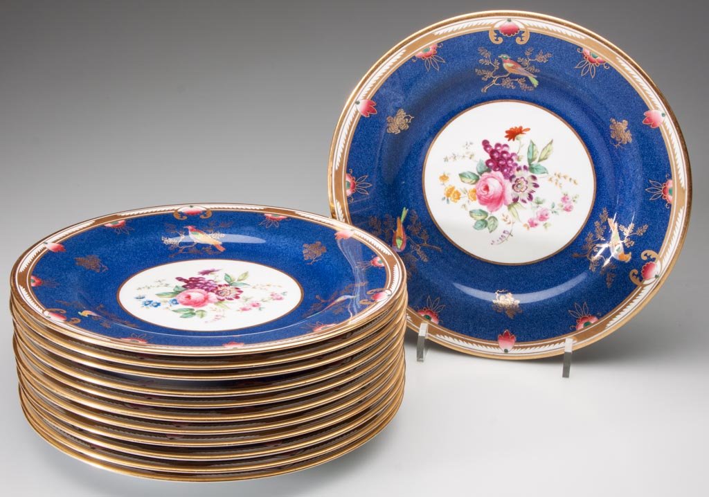 COPELAND SPODE LUNCHEON PLATES, SET OF 12: COPELAND SPODE LUNCHEON PLATES, SET OF 12, each featuring a hand-painted floral center surrounded by a wide blue border with three birds perched on a branch and a gilt rim, impressed and green under-g