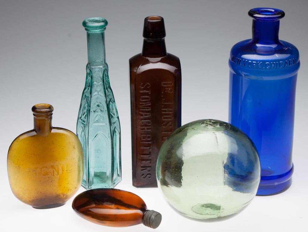 ASSORTED GLASS BOTTLES AND RELATED ARTICLES, LOT OF SIX: ASSORTED GLASS BOTTLES AND RELATED ARTICLES, LOT OF SIX, including a teal Gothic peppersauce with rough pontil mark, a cobalt "PAUL'S INKS", a honey amber "PICNIC" flask, and a yellow green float with