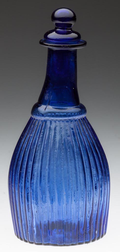 BLOWN-MOLDED GI-7 TYPE II CRUET OR TOILET BOTTLE: BLOWN-MOLDED GI-7 TYPE II CRUET OR TOILET BOTTLE, purple blue, plain flanged mouth above an unpatterned neck, plain base with rough pontil mark, matching hollow Tam-O'-Shanter stopper. Probably Boston
