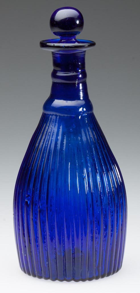 BLOWN-MOLDED GI-7 TYPE IV VARIANT CRUET OR TOILET: BLOWN-MOLDED GI-7 TYPE IV VARIANT CRUET OR TOILET BOTTLE, deep cobalt blue, lacking neck ribs both between rings and above upper ring, plain mouth, ribbed base with rough pontil mark, period solid bal