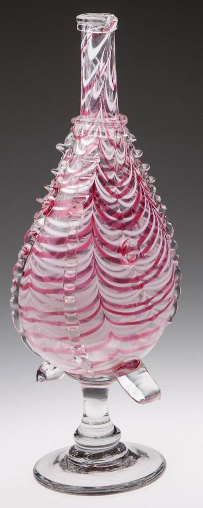 FREE-BLOWN MARBRIE-LOOP-DECORATED BELLOWS BOTTLE WHIMSY: FREE-BLOWN MARBRIE-LOOP-DECORATED BELLOWS BOTTLE WHIMSY, colorless with opal and rose loopings, body with applied colorless rigaree decorations, double neck ring and two lower handles, raised on a sol